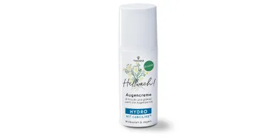 Abbildung einer Augencreme -Hellwach- von Thoma. Die Verpackung zeigt eine grüne Gestaltung mit floralen Elementen und dem Hinweis -Kran-beöl-. Die Augencreme ist in einem weißen Airless-Spender mit silbernem Deckel verpackt und verspricht eine erfrische